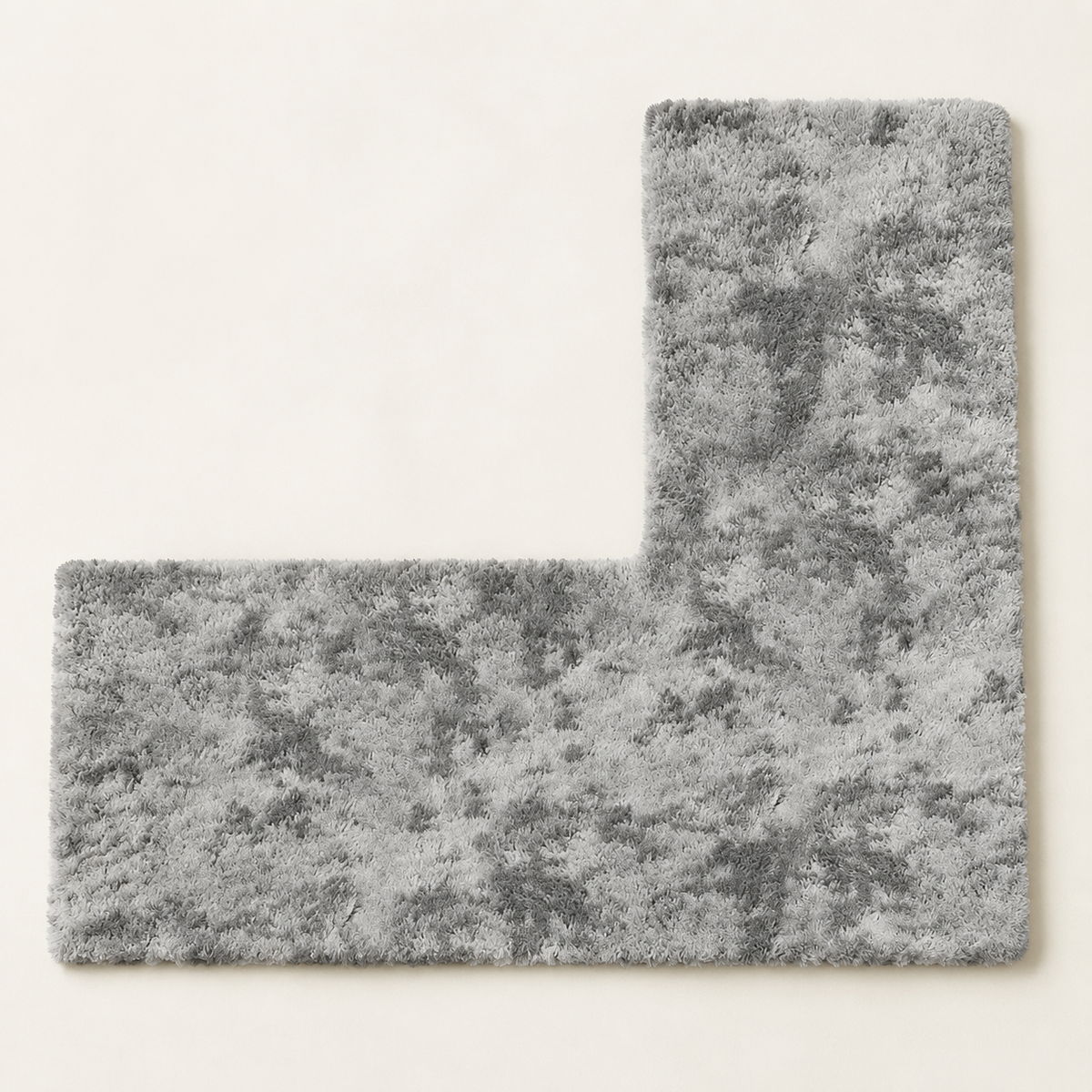 Vue de dessus du tapis de douche gris en forme de L